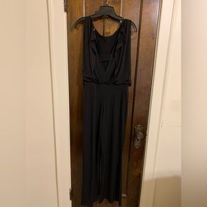 Black jumpsuit with low cut back.
